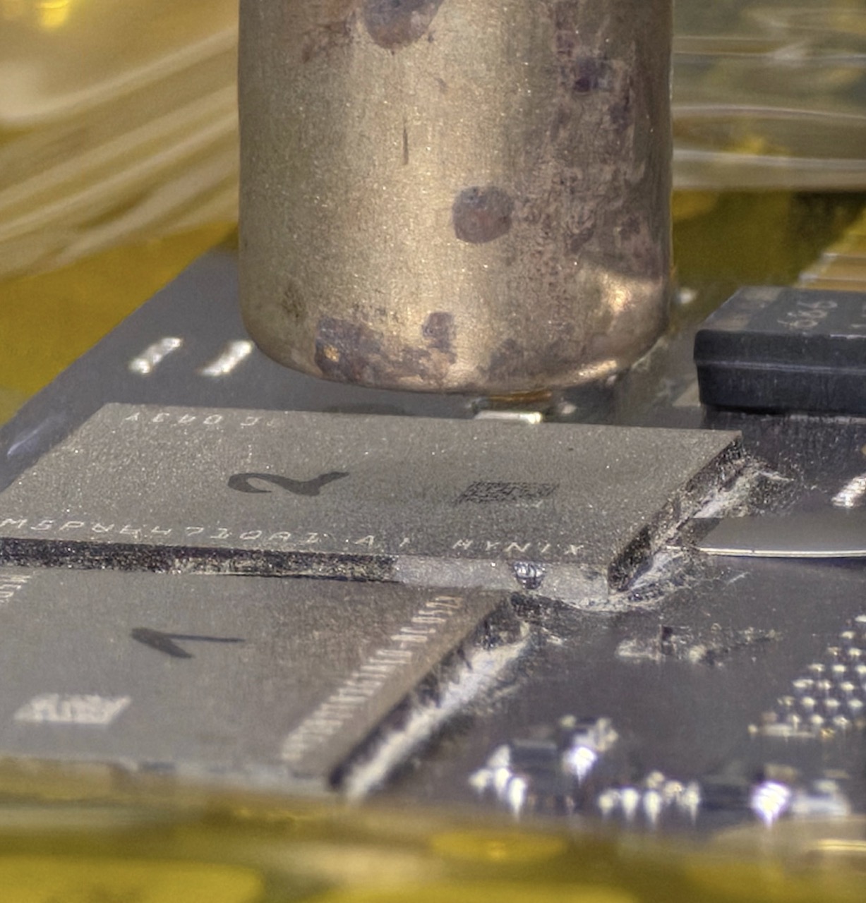 BGA knife just before sliding under the NAND